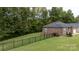 Spacious backyard with a black metal fence and green lawn at 133 Ole Eastpointe Dr, York, SC 29745