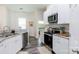 Clean kitchen featuring stainless steel appliances and white cabinets at 133 Ole Eastpointe Dr, York, SC 29745