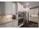 Well-equipped kitchen with double ovens and stainless steel refrigerator at 4050 Halyard Dr, Denver, NC 28037