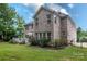 Brick house with a large deck and lush landscaping at 4050 Halyard Dr, Denver, NC 28037