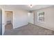 Charming bedroom with window and access to another room at 13315 Hunting Birds Ln, Charlotte, NC 28278