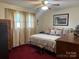 Large bedroom with king-size bed, ample closet space, and carpet at 4040 Angus Dr, Gastonia, NC 28056