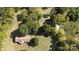 Aerial view of a house and surrounding land with additional structures at 1270 Stanback Rd, Mount Gilead, NC 27306