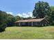 Brick ranch house on a large grassy lot with trees at 1270 Stanback Rd, Mount Gilead, NC 27306