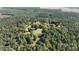 Aerial view of a house nestled in a wooded area with spacious grounds at 1270 Stanback Rd, Mount Gilead, NC 27306