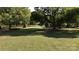 Large backyard with mature trees and an old stone structure at 1270 Stanback Rd, Mount Gilead, NC 27306