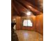 Living room with wood paneling, tile floor, and fireplace at 1270 Stanback Rd, Mount Gilead, NC 27306