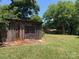 Rustic wooden shed with double doors at 1270 Stanback Rd, Mount Gilead, NC 27306
