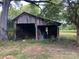 Old wooden barn with open sides at 1270 Stanback Rd, Mount Gilead, NC 27306