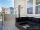 Outdoor deck with sectional sofa and view of neighboring townhouses at 2318 Medley Dr, Charlotte, NC 28262