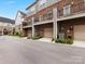 Brick townhomes with attached garages and private decks at 15021 New Amsterdam Ln, Charlotte, NC 28204