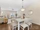 Bright dining area with white table and kitchen access at 15021 New Amsterdam Ln, Charlotte, NC 28204