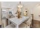 White dining table with kitchen and stairs visible at 15021 New Amsterdam Ln, Charlotte, NC 28204