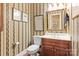 Elegant powder room with wood vanity and decorative wallpaper at 1408 Stone Gate Dr, Shelby, NC 28150