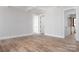 Bright living room with hardwood floors and access to other rooms at 195 Agnew Rd, Mooresville, NC 28117