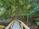 Wooden footbridge leads to wooded area at 195 Agnew Rd, Mooresville, NC 28117