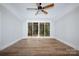 Large bedroom with sliding glass doors leading to backyard at 195 Agnew Rd, Mooresville, NC 28117