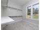 Large walk-in closet with built-in shelves and window at 195 Agnew Rd, Mooresville, NC 28117