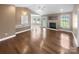 Bright and airy living room with hardwood floors and fireplace at 1151 Glenbriar Ct, Woodleaf, NC 27054