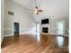 Large living room with hardwood floors and a fireplace at 2510 Doster Rd, Monroe, NC 28112