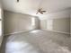 Bright bedroom with ceiling fan and ample closet space at 2510 Doster Rd, Monroe, NC 28112