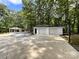 Two-car garage with a separate carport and basketball court at 2510 Doster Rd, Monroe, NC 28112