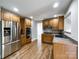 View of kitchen with stainless steel appliances and wood cabinets at 2510 Doster Rd, Monroe, NC 28112