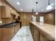 Basement kitchen with island and wood cabinetry at 2510 Doster Rd, Monroe, NC 28112