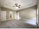 Main bedroom with tray ceiling, ceiling fan and ample natural light at 2510 Doster Rd, Monroe, NC 28112