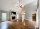 Open living room with hardwood floors and a kitchen view at 2510 Doster Rd, Monroe, NC 28112
