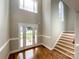Two-story entryway with hardwood floors and staircase at 2510 Doster Rd, Monroe, NC 28112