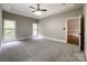 Main bedroom with ceiling fan and access to en-suite bathroom at 2510 Doster Rd, Monroe, NC 28112