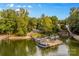 Aerial view of lakefront property with multiple boat slips at 241 Spring Shore Rd, Statesville, NC 28677