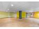 Large unfinished basement with painted walls and wood stove at 241 Spring Shore Rd, Statesville, NC 28677
