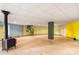Unfinished basement featuring a spiral staircase and wood stove at 241 Spring Shore Rd, Statesville, NC 28677