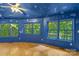 Bright living room featuring hardwood floors and scenic wooded views at 241 Spring Shore Rd, Statesville, NC 28677