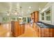 Open kitchen with island and wood cabinets at 241 Spring Shore Rd, Statesville, NC 28677