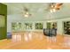 Spacious living room with hardwood floors, vaulted ceilings, and a spiral staircase at 241 Spring Shore Rd, Statesville, NC 28677