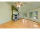 Living room with a gas fireplace and wood-look floors at 241 Spring Shore Rd, Statesville, NC 28677