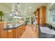 Open kitchen with island and wood cabinets at 241 Spring Shore Rd, Statesville, NC 28677