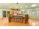 Kitchen with island, wood cabinets, and window views at 241 Spring Shore Rd, Statesville, NC 28677