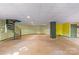 Unfinished basement with a spiral staircase and painted walls at 241 Spring Shore Rd, Statesville, NC 28677