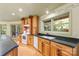 Kitchen with wood cabinets, granite counters, and sink at 241 Spring Shore Rd, Statesville, NC 28677