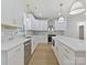 White kitchen with gold fixtures, stainless steel appliances, and ample counter space at 1467 Centennial Dr, Rock Hill, SC 29732