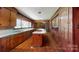 Retro kitchen with wood cabinets and center island at 6212 Reepsville Rd, Vale, NC 28168