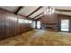 Living room featuring a brick fireplace and wood paneling at 6212 Reepsville Rd, Vale, NC 28168