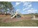 playground with slide and climbing structure at 4243 Houldsworth Dr, Charlotte, NC 28213