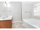 Bathroom with double vanity, shower, and bathtub at 8708 Berrybrook Ln, Charlotte, NC 28269