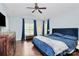 Main bedroom with a high ceiling and dark blue bedding at 1001 Serel Dr, Matthews, NC 28104