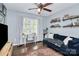 Home office or den with a comfortable couch and workspace at 1001 Serel Dr, Matthews, NC 28104